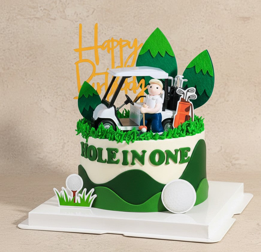 Hole in One Celebration Cake with golfer figurine, golf cart, and piped grass design for themed birthday.
