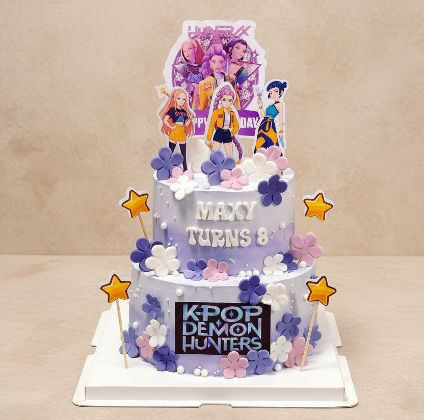 K-Pop themed celebration cake featuring vibrant decorations for a pink and purple birthday.