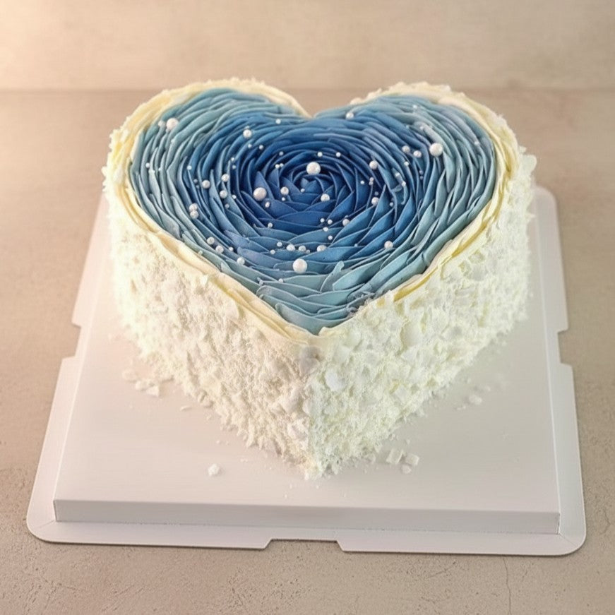 Starlight Blue Heart Cake with ombré blue petals and pearl accents on a white background, perfect for Mother's Day.