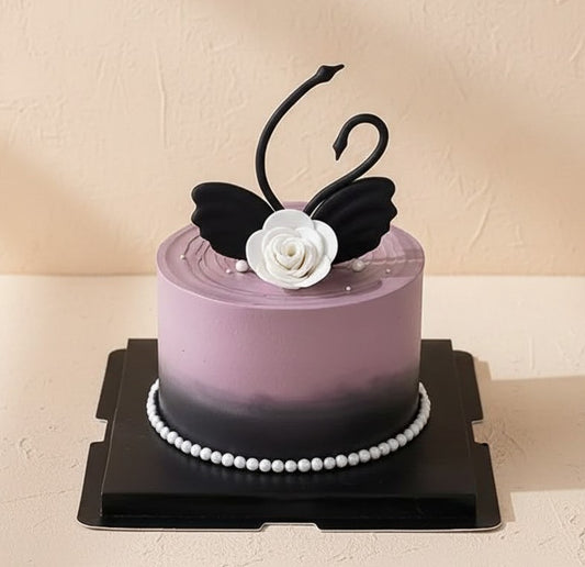 Black Swan Elegance Cake Singapore with black swan decoration and ombré design in mauve and charcoal.