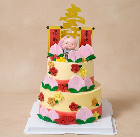 Longevity Peach Blossom Cake featuring colorful flowers and God of Longevity decoration by Good Day Bakery Singapore.
