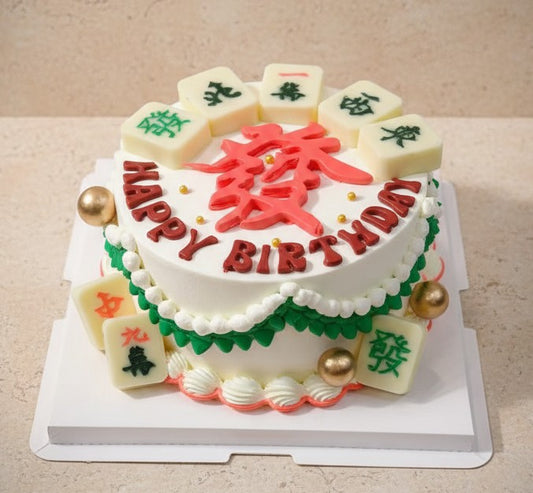 Mahjong birthday cake decorated with fondant tiles and vibrant cream icing for a festive celebration.