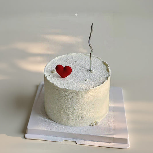 Silent Heart Cake Singapore with minimalist design, white frosting, and a red heart decoration.