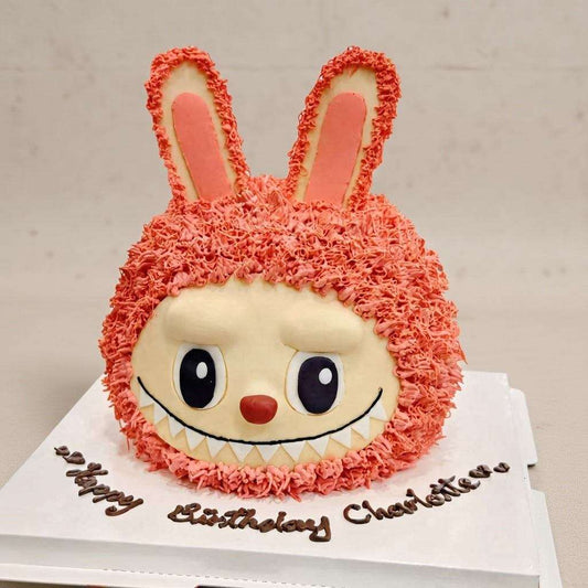 3D bunny cake with pink buttercream fur and monster grin