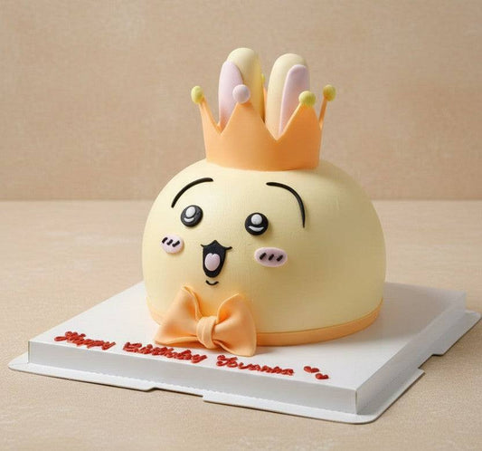 3D bunny cake with pastel yellow frosting and golden crown