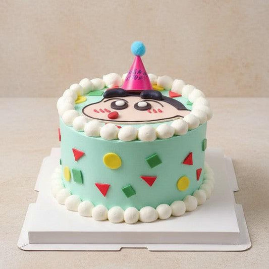 Crayon Shin-chan Cake with geometric pajama patterns, 3D pink party hat, and white cream borders