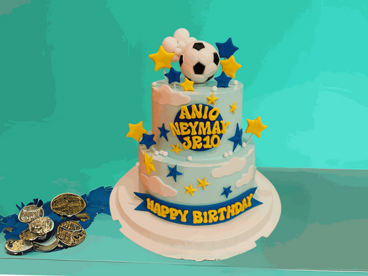 two-tier goal getter soccer cake with 3d soccer ball topper and blue yellow accents