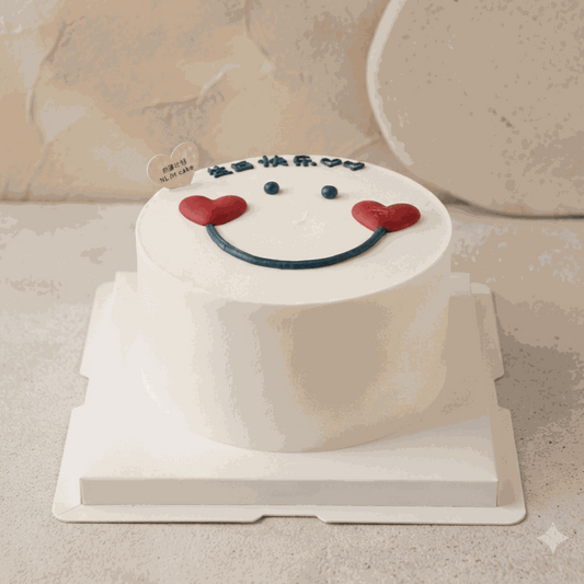 Minimalist HeartCake with Korean heart smiley face, white frosting, navy blue eyes, red heart cheeks, and "生日快乐" calligraphy birthday cake