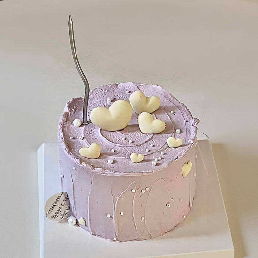 Lilac heart cake with lavender frosting and 3D ivory hearts