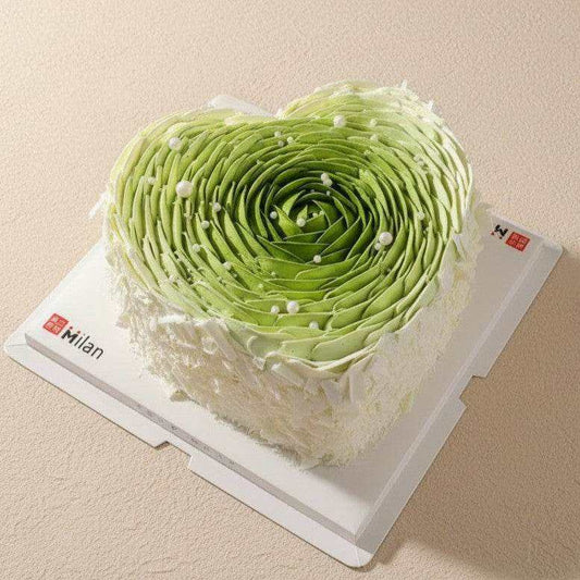 Matcha heart cake with botanical ombre ruffles and white pearl accents