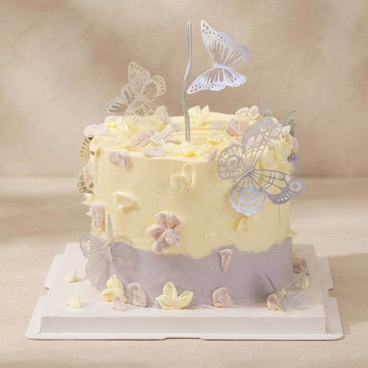 Pastel two-tone butterfly cake Singapore with hand-piped petals and 3D silver filigree butterflies