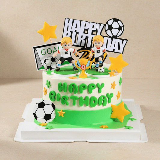 Soccer cake with 3D soccer player figurines, green pitch base, and championship trophy