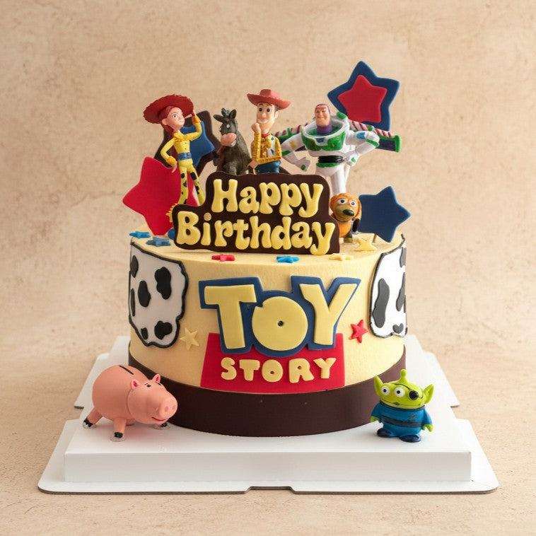 Toy Story cake with Woody, Buzz Lightyear, and friends figurines
